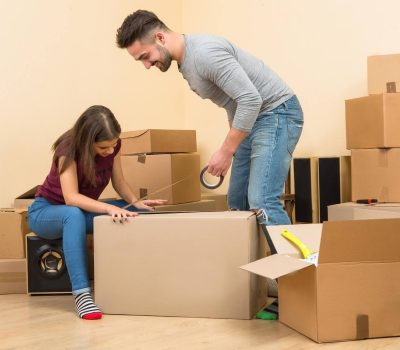 couple packing the things in boxe