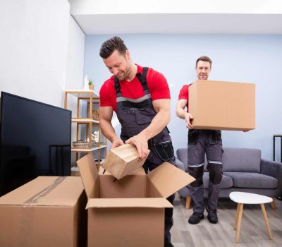 man packing and moving boxes