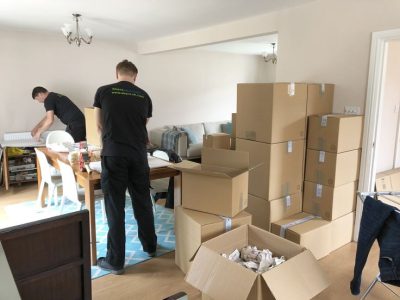 moving company workers packing things