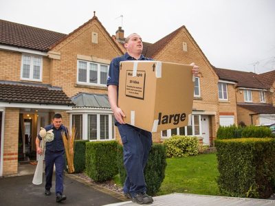 moving company workers holding boxes