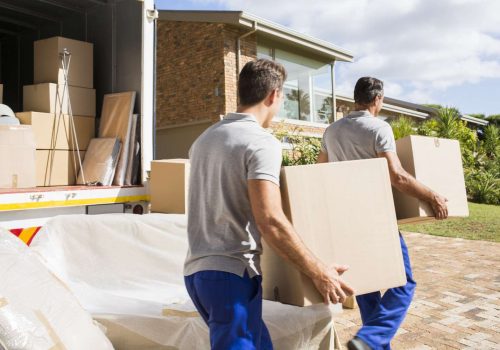 two men holding boxes